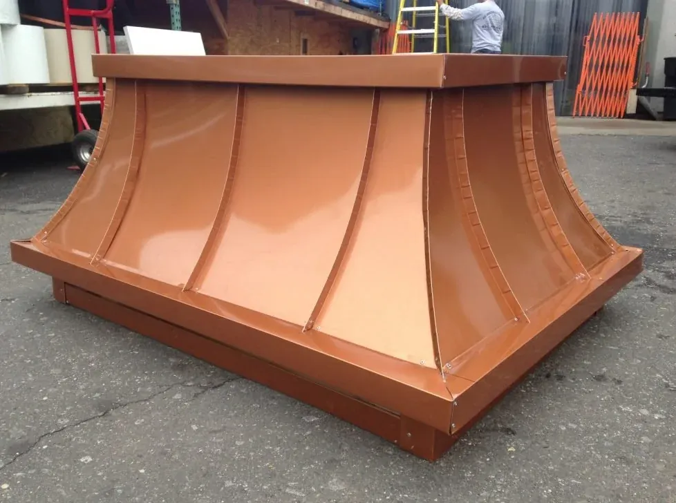 New copper cupola with a curved ribbed roof on a square base