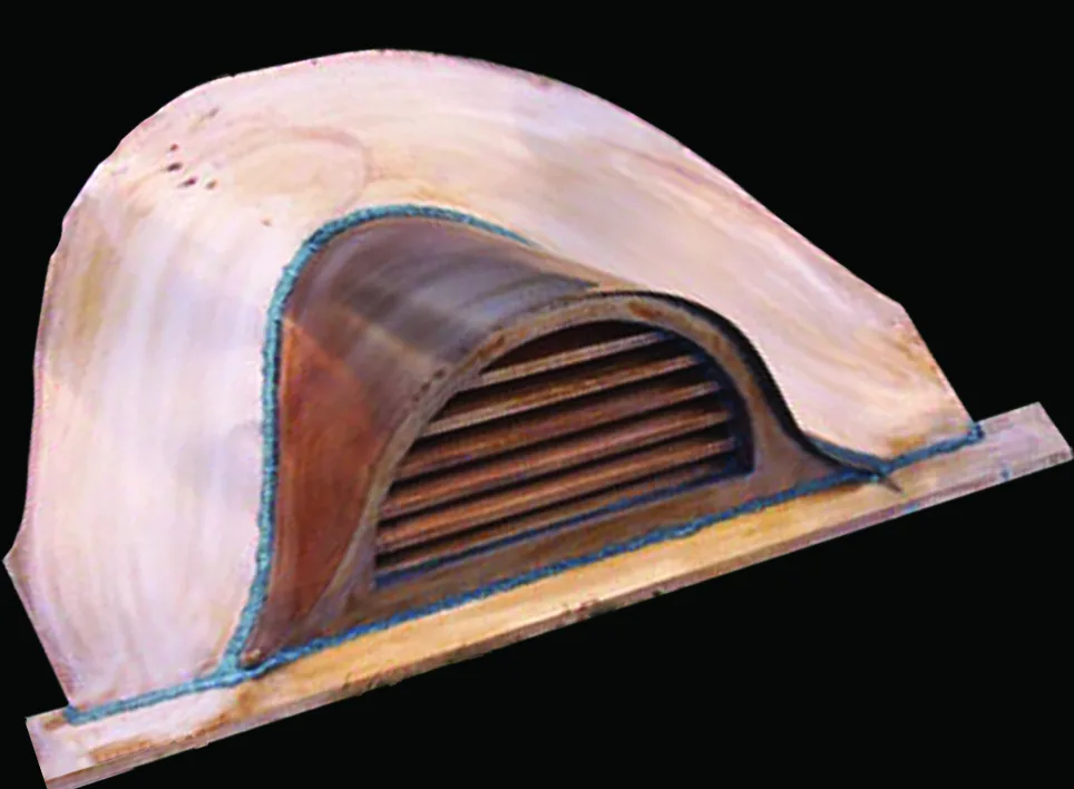 Copper eyebrow dormer with an arched louvered vent